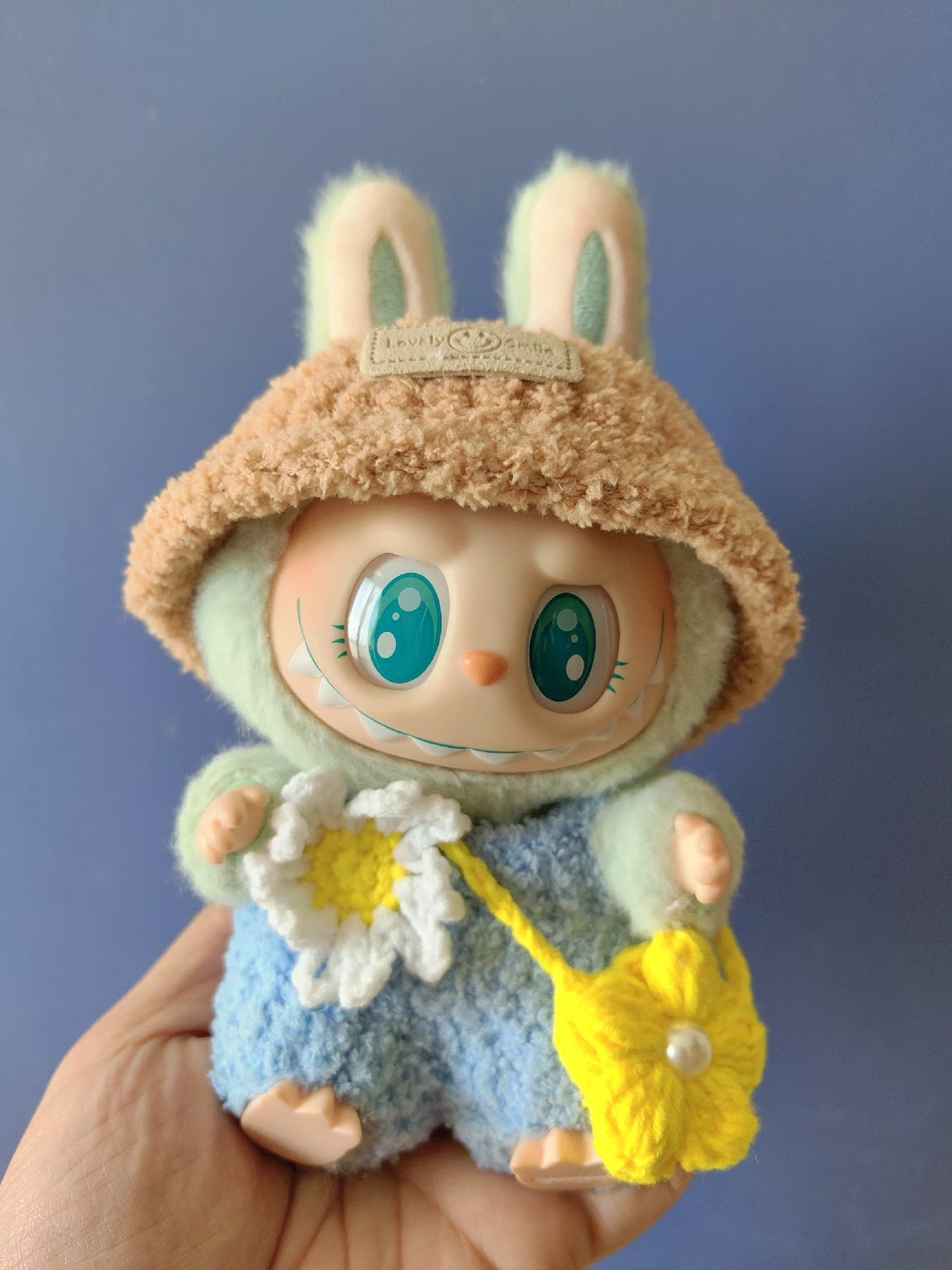 Charming Labubu Spring Outfit: Bunny Hat, Floral Blue Ensemble & Yellow Handbag for Playful Style - Image 3
