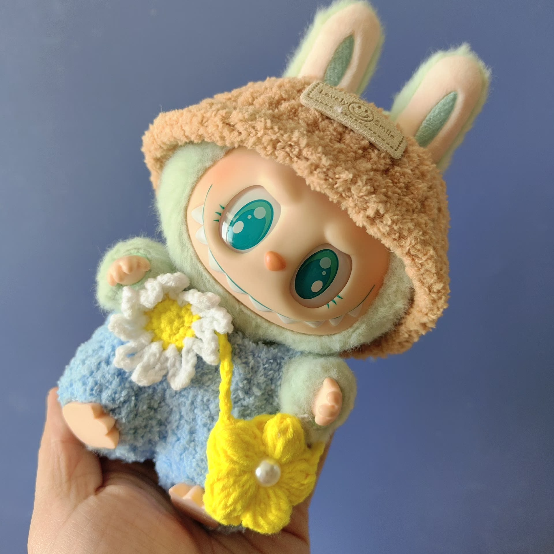 Charming Labubu Spring Outfit: Bunny Hat, Floral Blue Ensemble & Yellow Handbag for Playful Style - Image 6