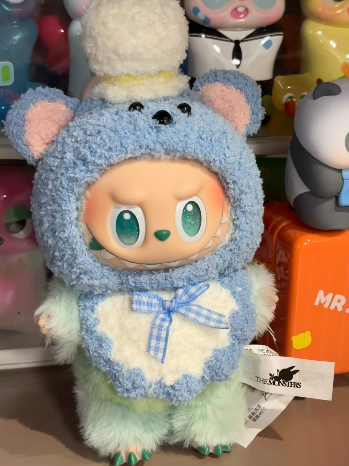 Adorable Plush Labubu Doll in Cozy Teddy Bear Outfit – Blue & White Collectible with Hat & Bow Tie - Image 1